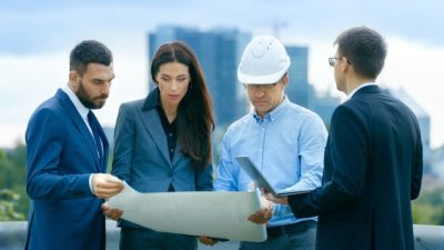 Construction team reviewing plans