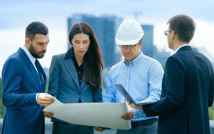 Construction team reviewing plans